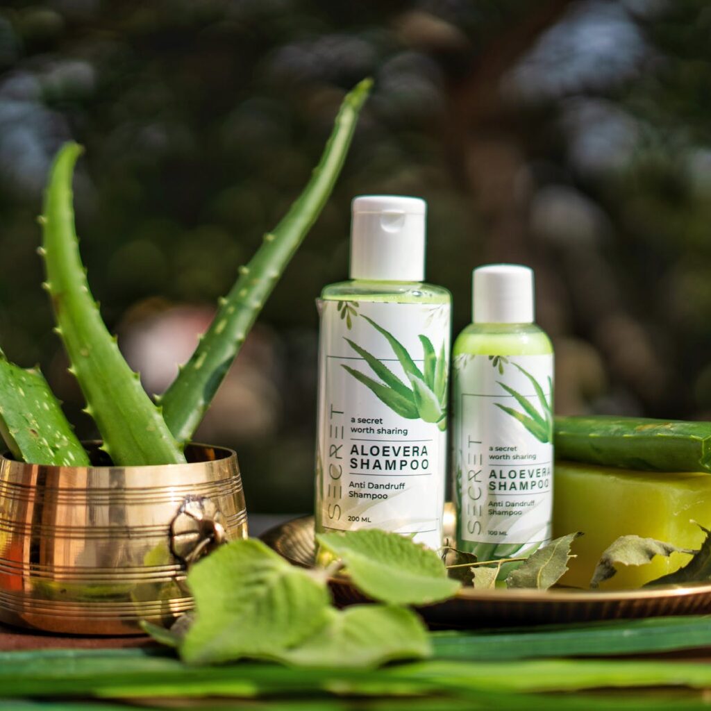 green and white bottles of shampoo on tray