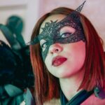 Rejuvenate Your Skin with Aloe Vera: Say Goodbye to Dryness A woman with black feathers and a mask