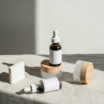 From short to lush: The secret to longer lashes with Aloe Vera Cosmetic Containers on Gray Textile