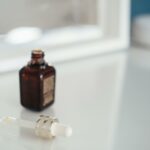 Grow Your Own Glamour: How Aloe Vera Can Boost Eyelash Growth Open bottle of aroma oil near dropper on table