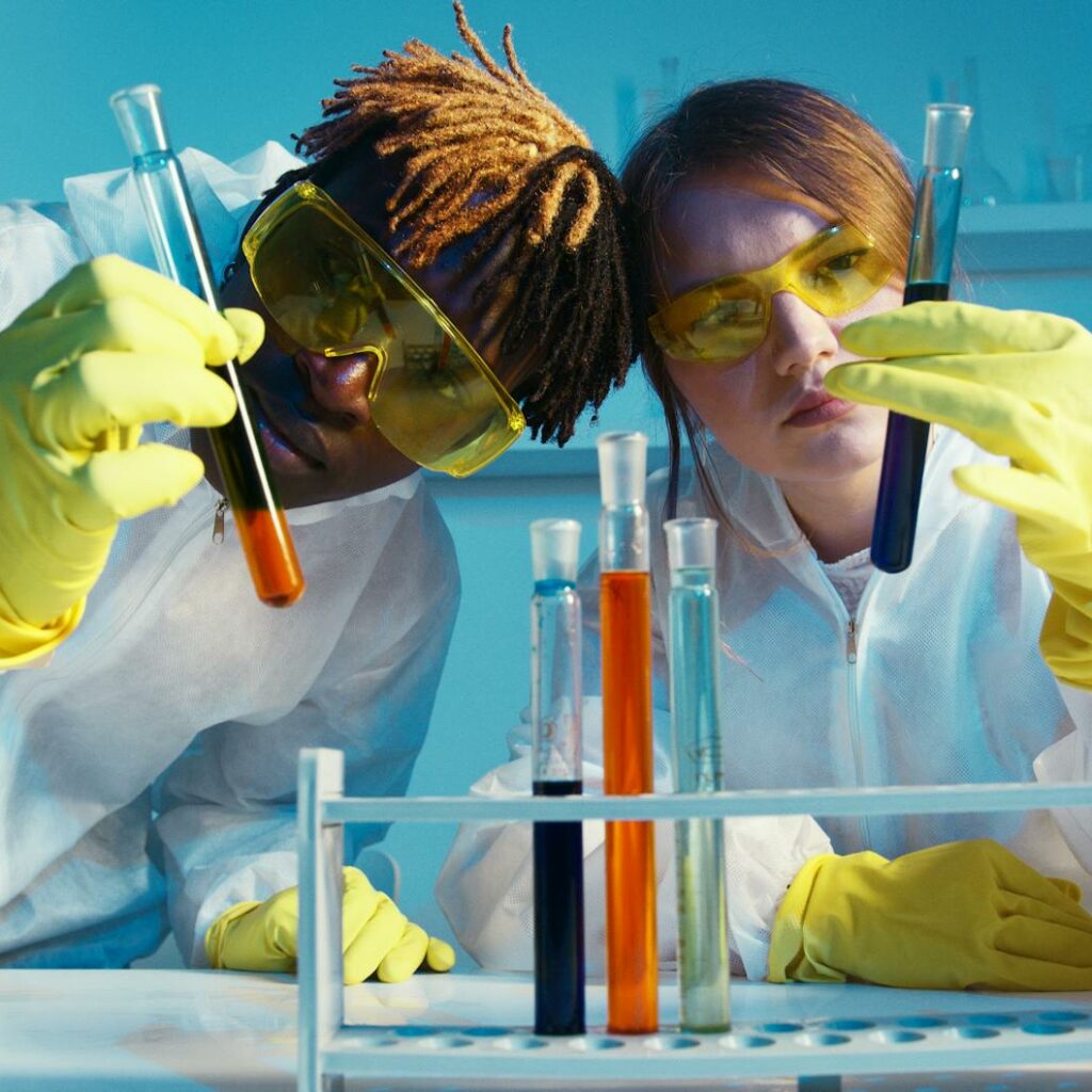 A Man and a Woman Holding a Test Tube