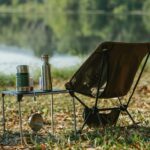 Cool Down and Hydrate: Aloe Vera for Post-Sun Relief Camping chair near table on river shore