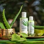 Aloe vera: Your secret weapon against oily locks Green and White Bottles of Shampoo on Tray