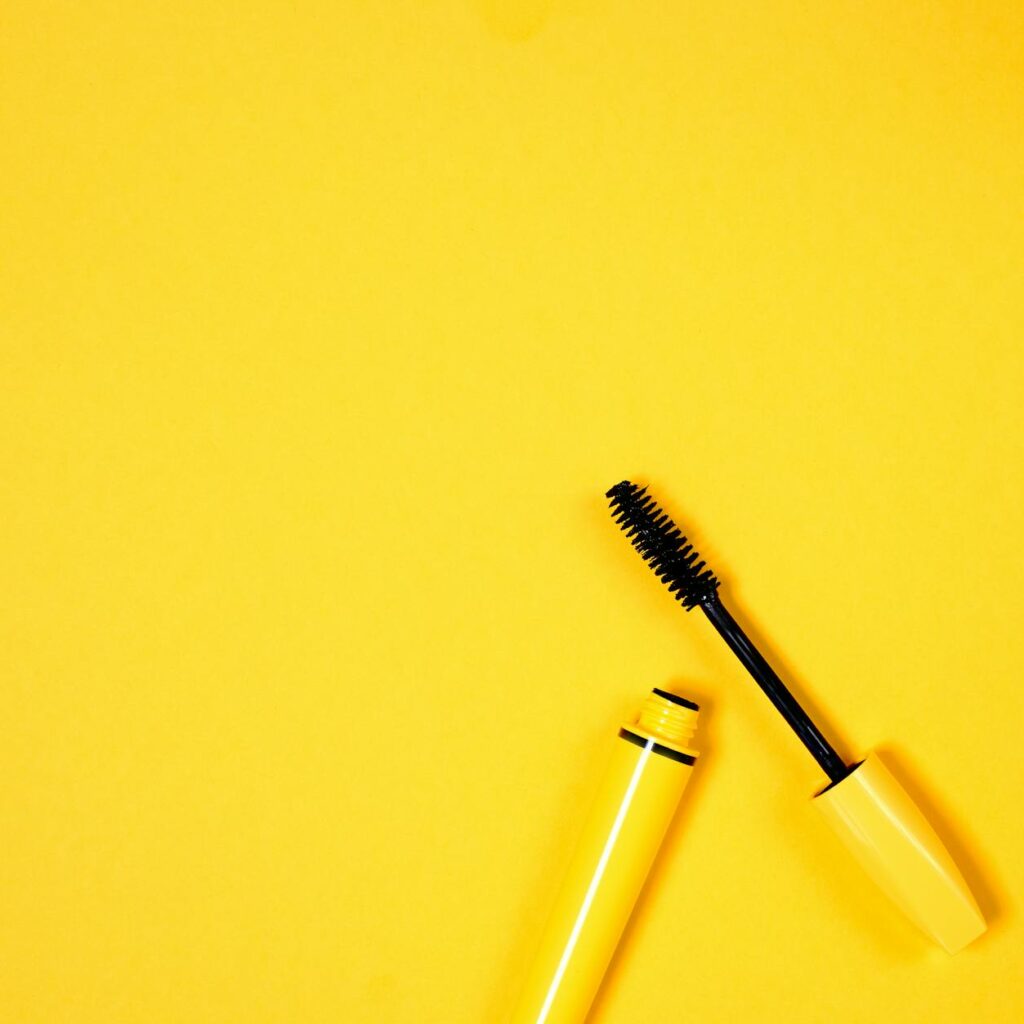 Yellow Mascara on Yellow Background